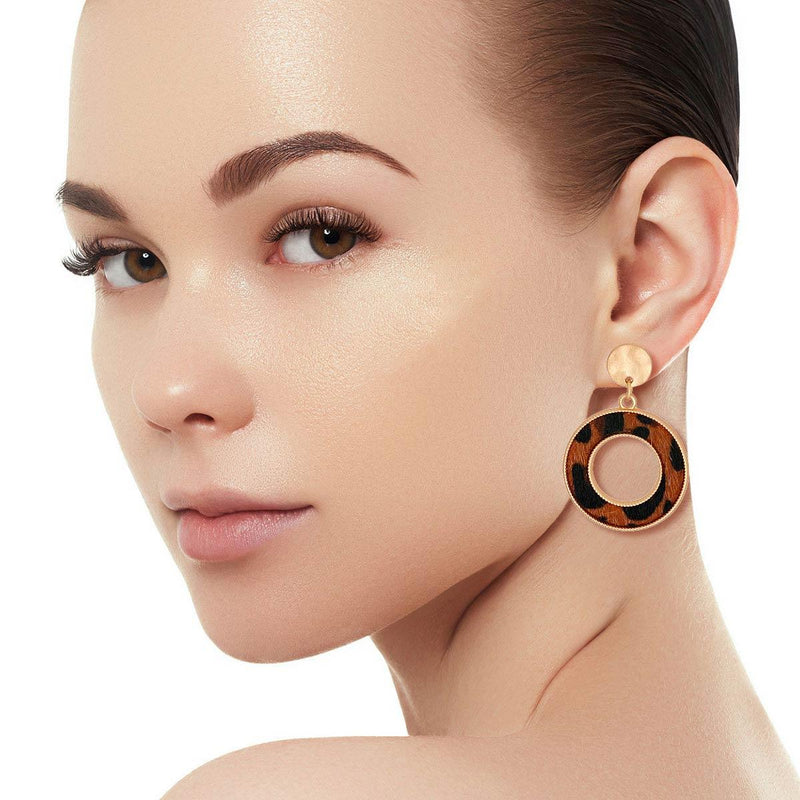 Brown Fur - Leopard Earrings The luxurious brown leopard fur is offset by the gold metal studs, making these earrings the perfect mix of glam and wildness. Gold Metal Round Stud Earrings Featuring Brown Leopard Fur Ring Drop Detail. Free shipping on orders over $50