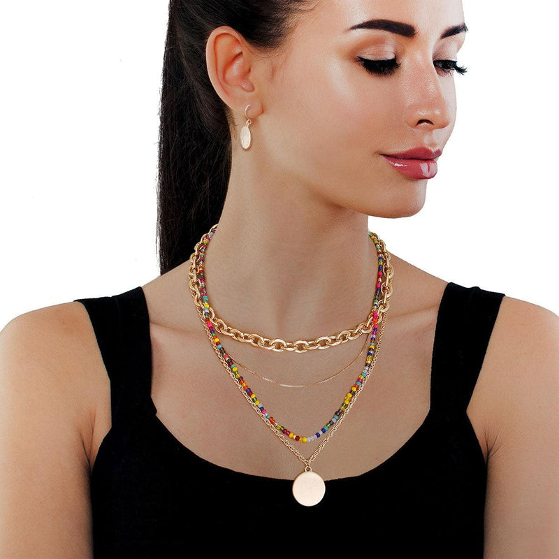 Layered Multicolor Necklace Gold Metal 4 Strand Necklace Set Featuring Multi Color Glass Bead Strand and a Variety of Chain Style Strands. Features Round Pendant. Necklace measures 15" to 18.5" Free shipping on orders over $50