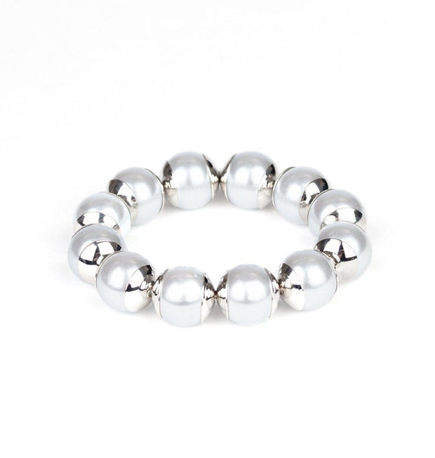 Image of the One Woman Show Stopper Silver Stretch Bracelet, showcasing oversized silver pearls threaded along a stretchy band. The bracelet exudes elegance and refinement, perfect for any occasion. Available at EJIJI Boutique.