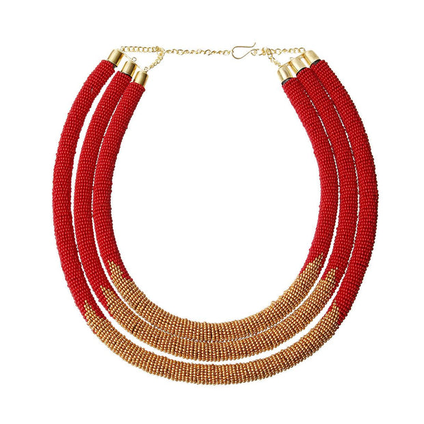 Zulu Jewelry - Beaded Collar Necklace - Red and Gold Necklace This unique piece is handcrafted by the talented Zulu Maasai tribe, and features layers of red and gold beads. Triple Layered Red and Gold Beaded Rope Necklace. Handcrafted. Fair Trade. Free shipping on orders over $50