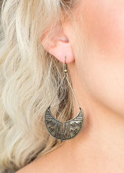 Brass Paparazzi earrings with tribal-inspired patterns and fishhook fittings.  EJIJI Boutique